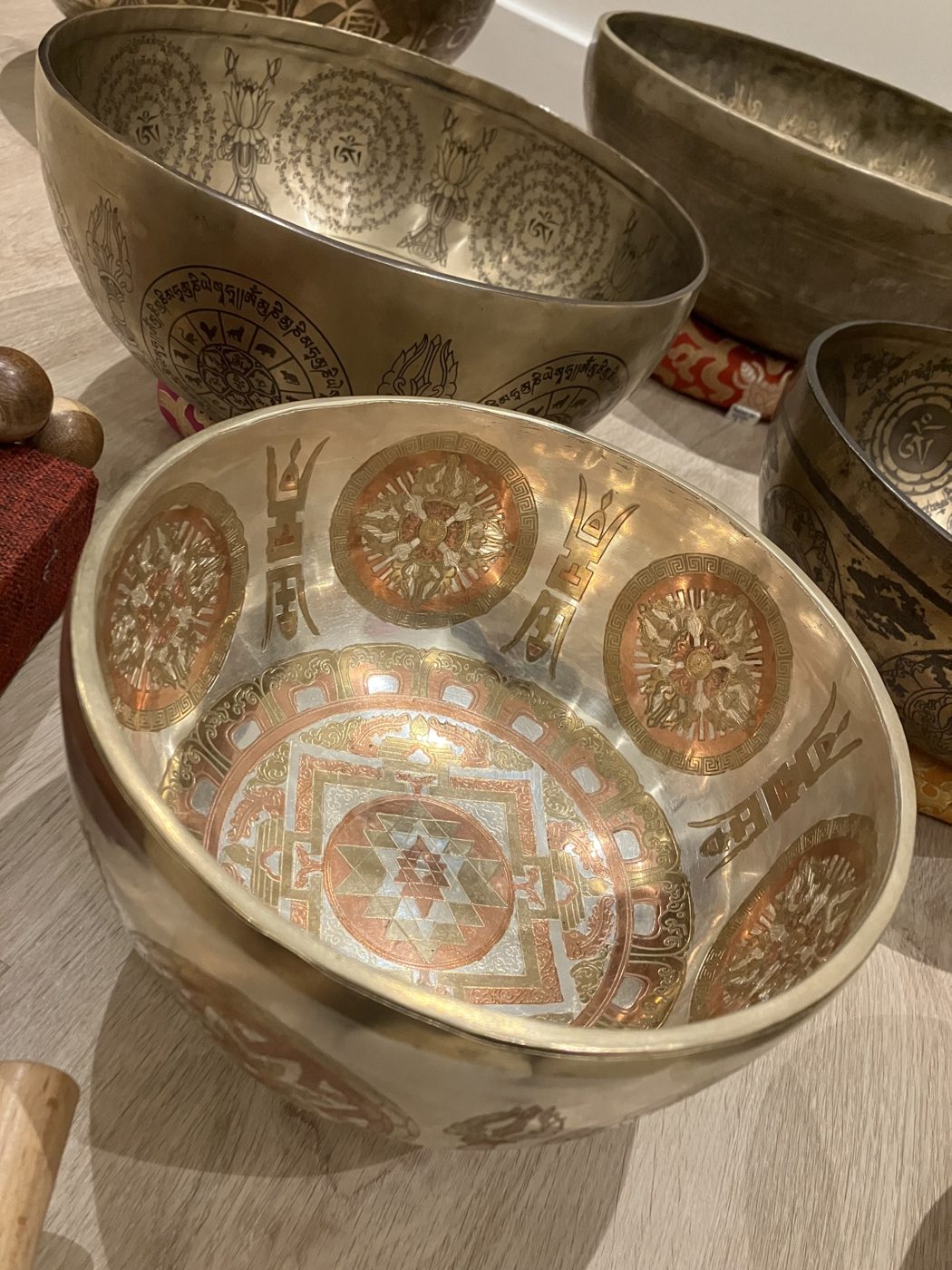 Tibetan singing bowls engraved with copper and gold mandalas